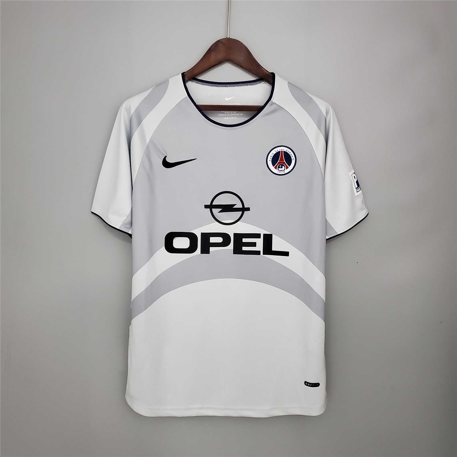 Maglia_PSG_2001_02_away_fronte_bianco_con_sponsor_Opel_5f4bdc64-f10b-466b-8a13-2b8a9a31ecb6.jpg