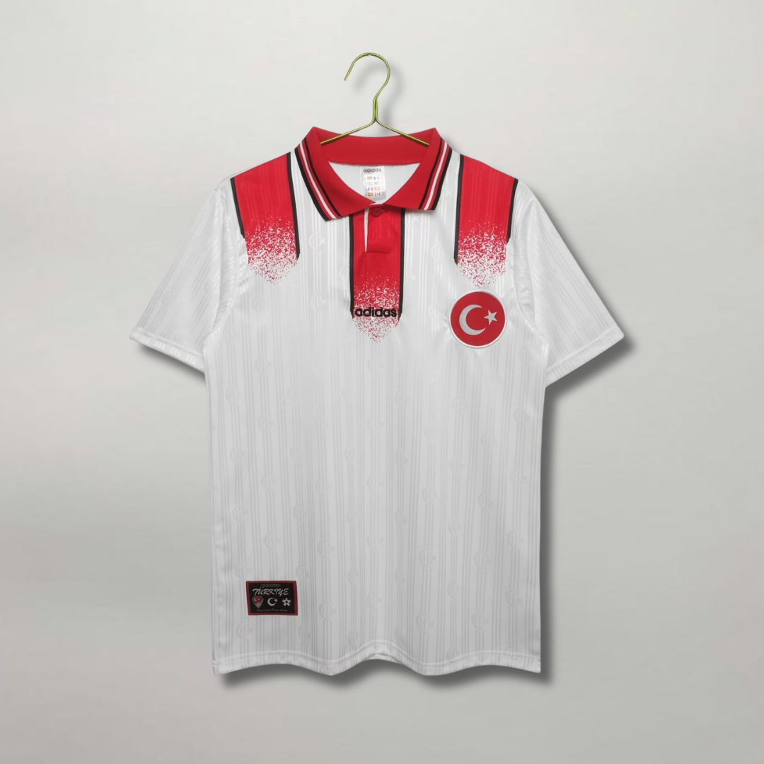 Maglia_Turchia_Away_1990_rossa_Adidas_con_banda_bianca_e_mezzaluna_centrale.png