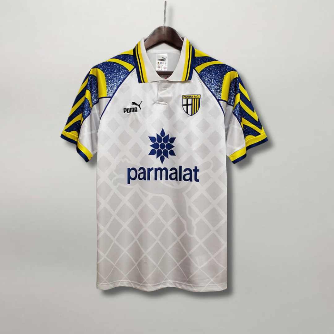 Vista_frontale_maglia_Parma_1995_96_away_con_pattern_geometrico_anni_90.png