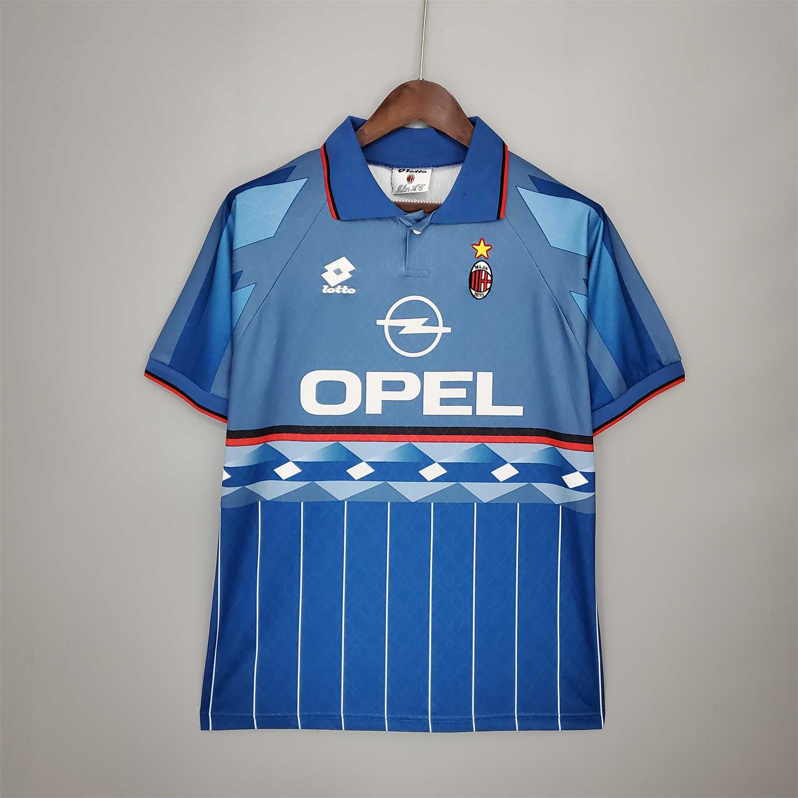 kit_vintage_blu_Milan_1995_96_con_colletto_a_polo_e_trame_verticali.jpg